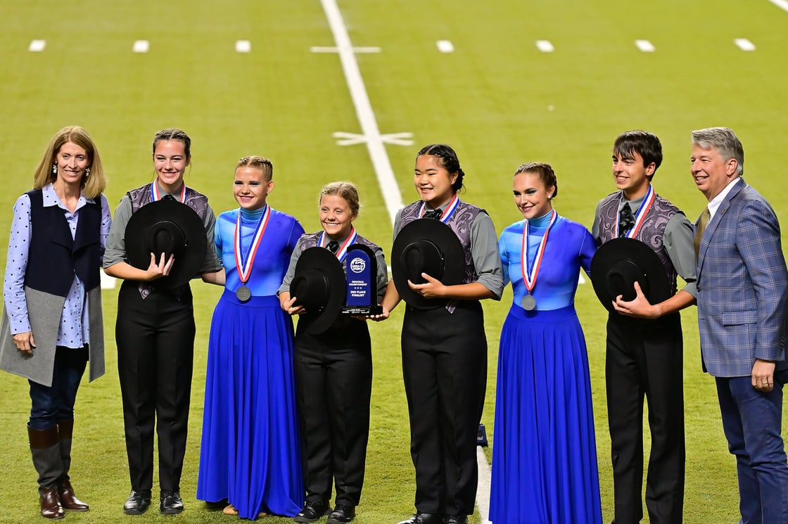 David Golden stands with six Dobyns-Bennett students on the Mini Dome field.