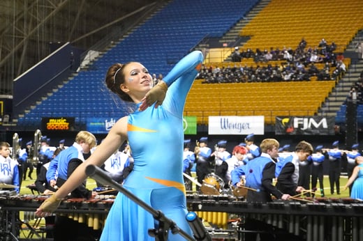 A West Ridge majorette dances during a performance.