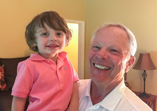 Doc and his seven year old grandson, Finnegan, are smiling.