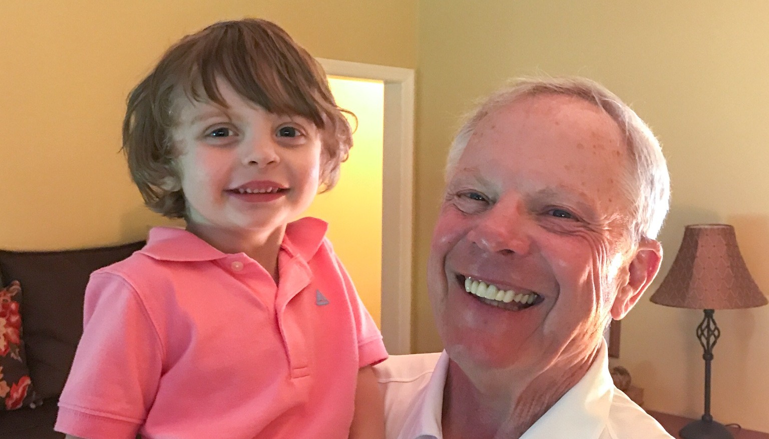 Doc Sander and now 7-year-old grandson Finnegan smiling together. 